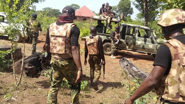 Nigerian soldiers on patrol in a rural area.