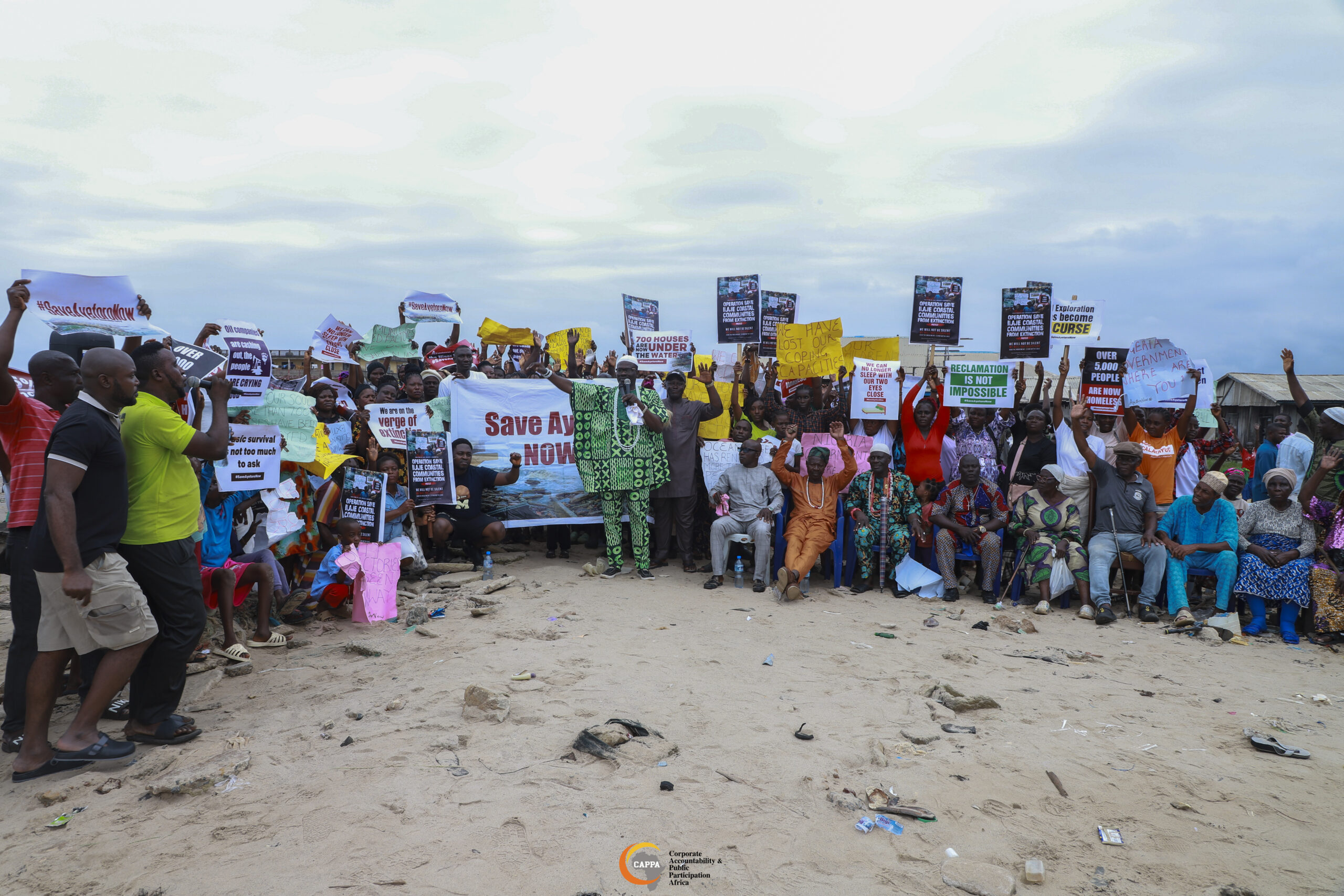 Ilaje community members protesting against ocean surge and demanding government action.